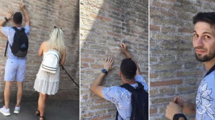 Un turista graba su nombre y el de su novia en una pared del Coliseo de Roma (+Video)